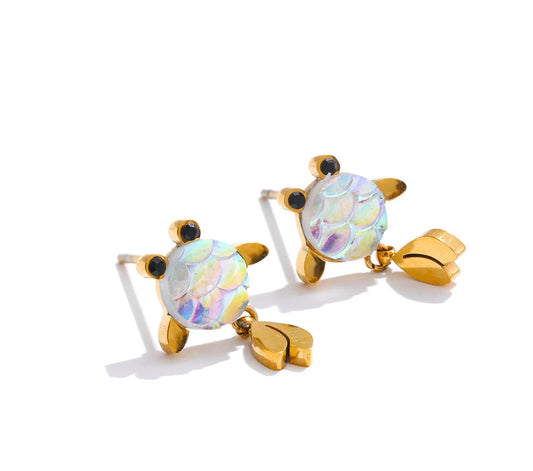 Tortoiseshell-shaped earrings with gold accents on a white background